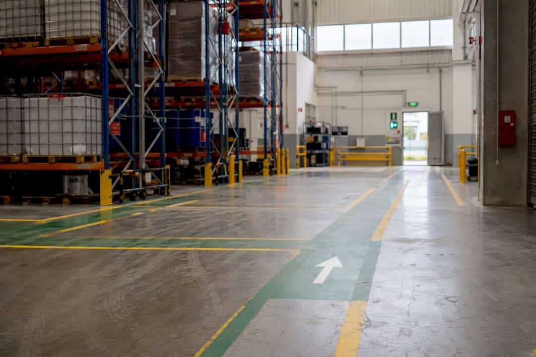 Wide marked evacuation route in industrial warehouse