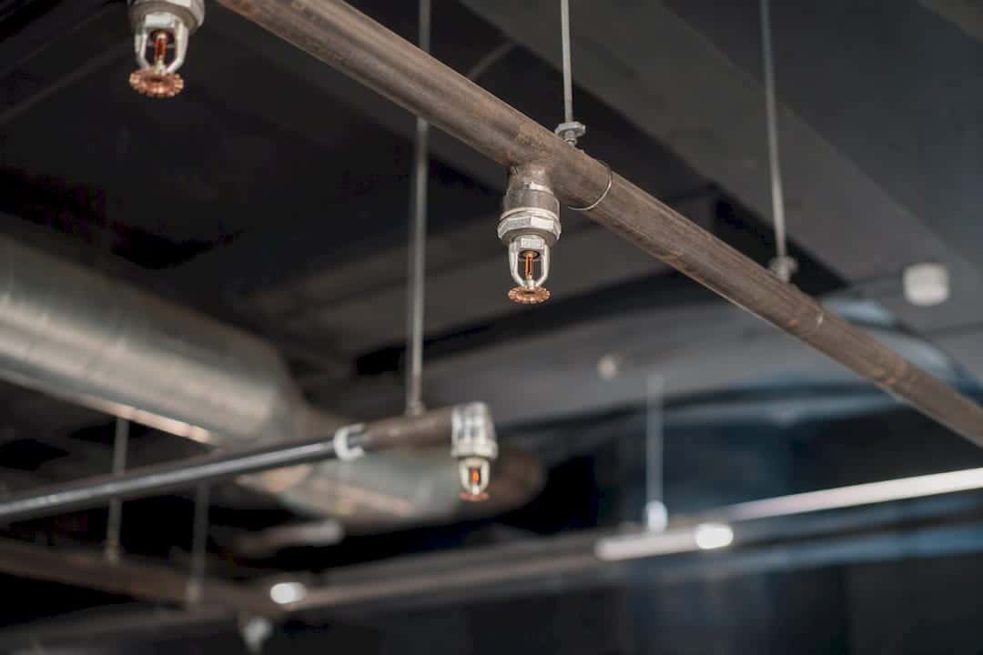 Close-up of sprinkler coverage in commercial ceiling