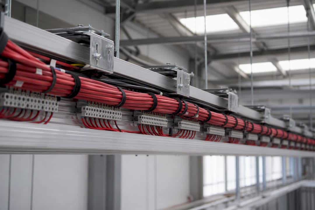 Neatly bundled fire alarm system wiring on cable tray