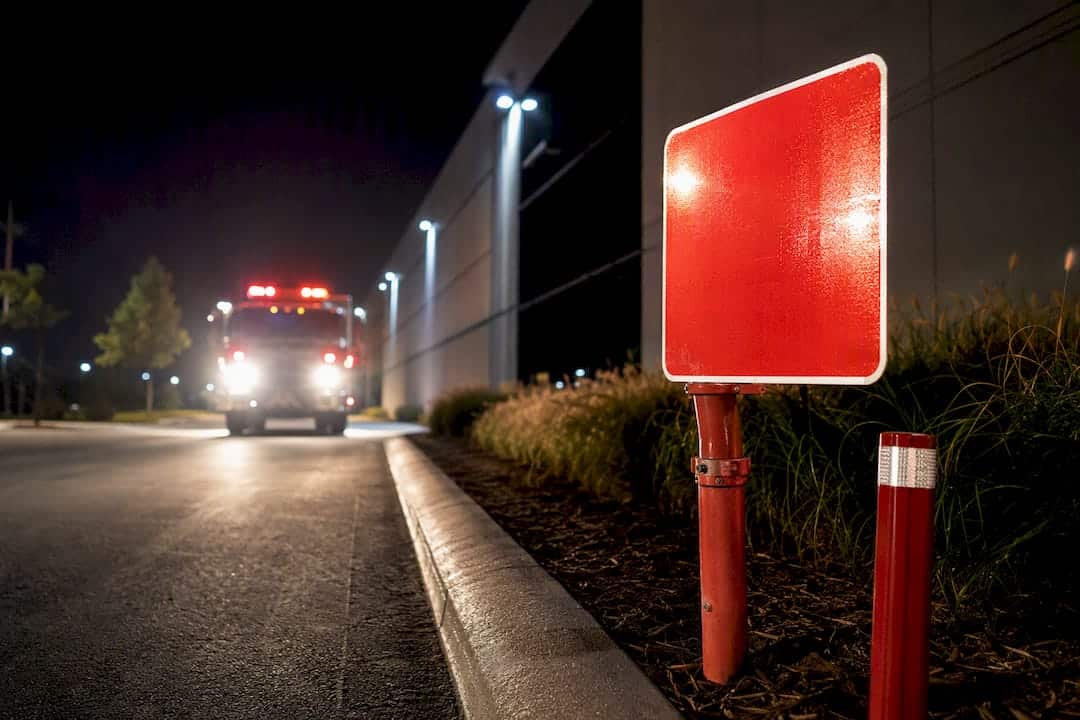 Reflective FDC sign illuminated by headlights
